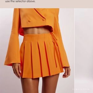 MESHKI Halle Pleated Wrap Mini Skirt - Tangerine